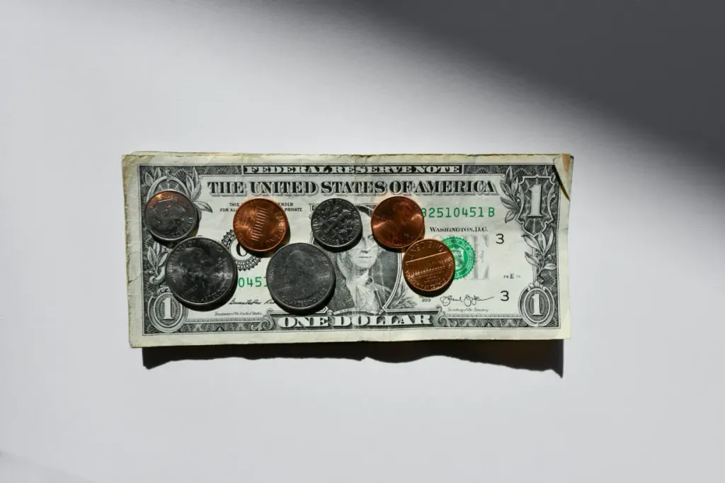 dollar-and-change-1211971befc514f5b4af255de54e558791d49961.webp
