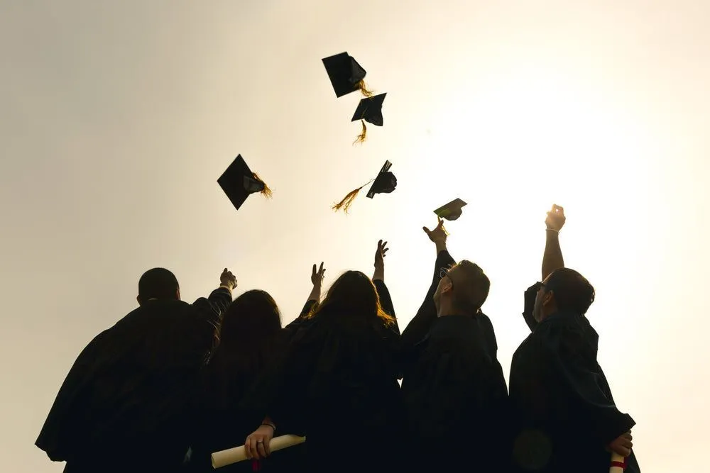 tossing-caps-at-graduation-6c30af508386e0e071b15c49c1c1044f1c7690a1.jpg